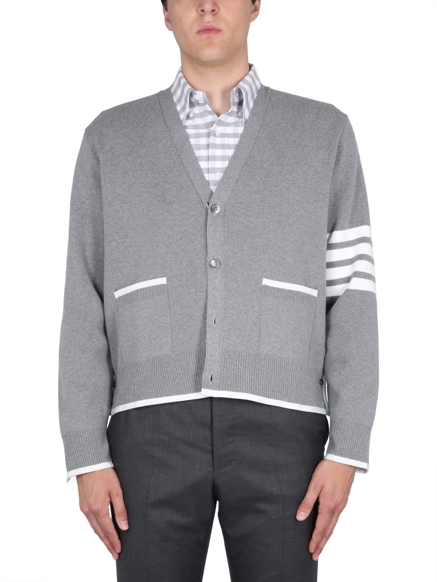 Refresh your wardrobe with the THOM BROWNE men's 4BAR STRIPE CARDIGAN in Grey