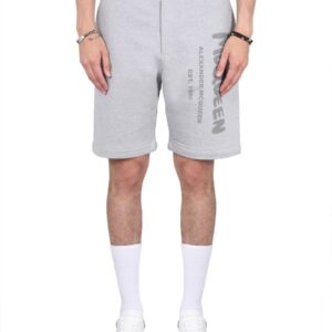 Explore the authentic Alexander Mcqueen men's BERMUDA SHORTS WITH GRAFFITI LOGO PRINT in Grey