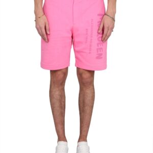 Shop the authentic Alexander Mcqueen men's BERMUDA SHORTS WITH GRAFFITI LOGO PRINT in Fuchsia