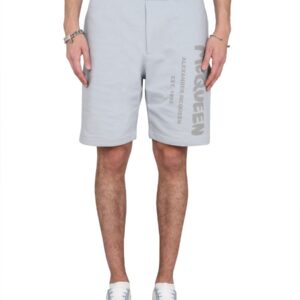Explore the authentic Alexander Mcqueen men's BERMUDA SHORTS WITH GRAFFITI LOGO PRINT in Azure
