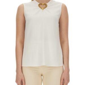 Explore the authentic Moschino women's BLOUSE WITH HEART APPLIQUE in White