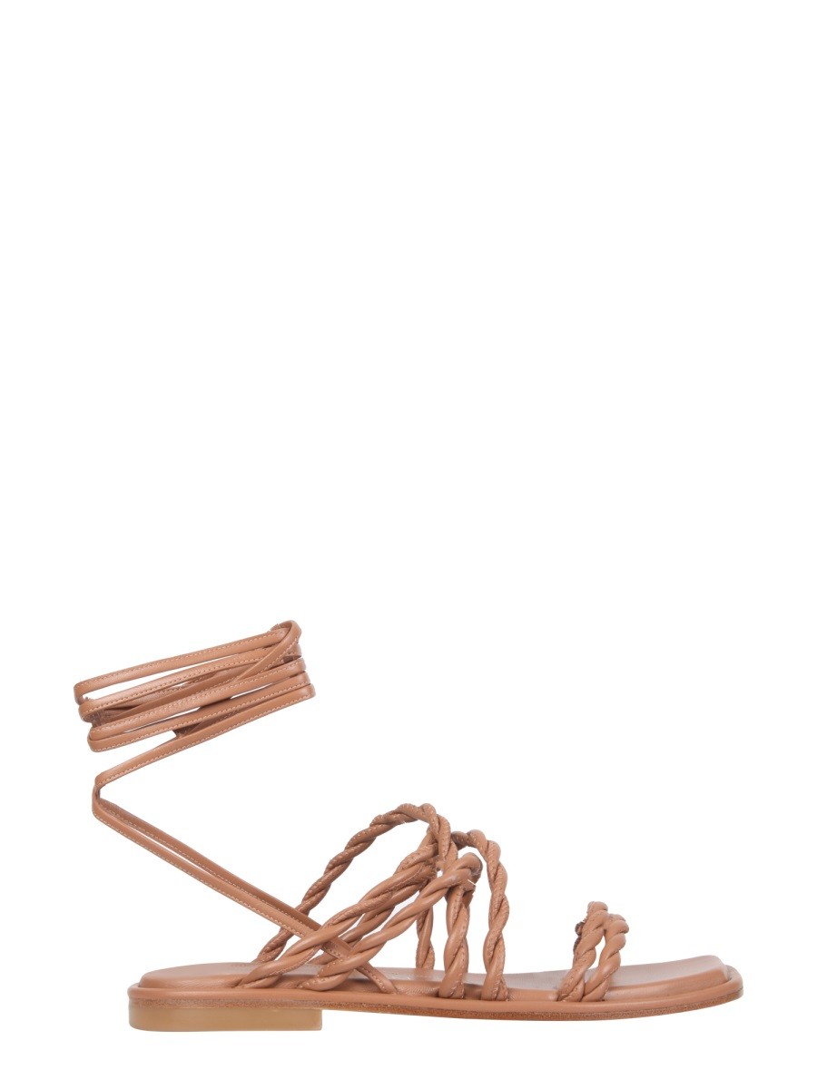 Discover the authentic Stuart Weitzman women's CALYPSO SANDALS in beige