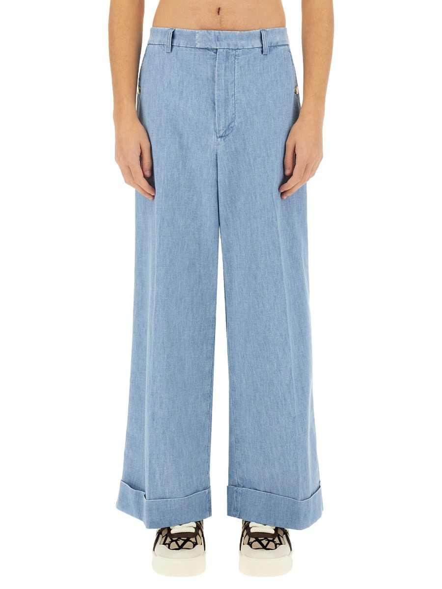 Refresh your wardrobe with the Valentino men's DENIM PANTS WITH LAPELS in DENIM