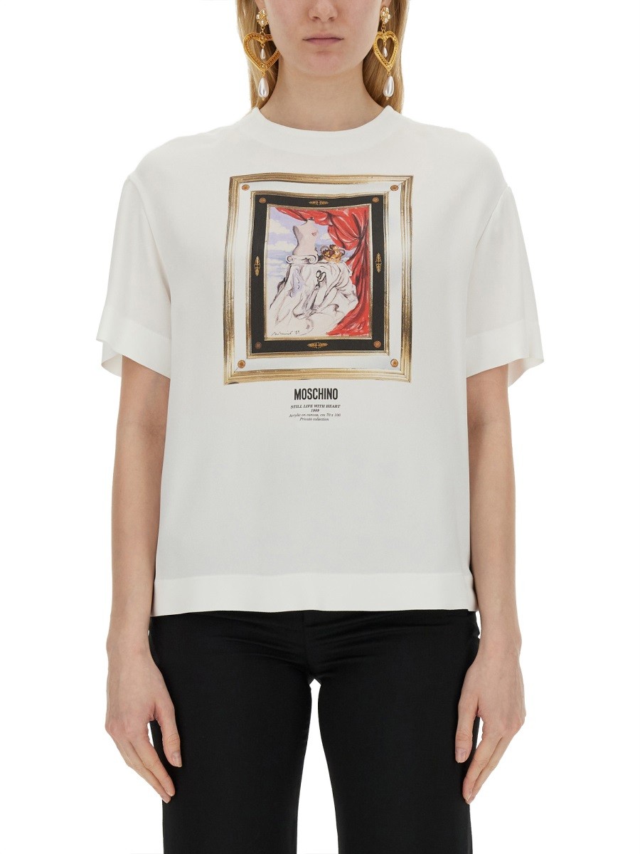 Explore the authentic Moschino women's ENVER SATIN BLOUSE STILL LIFE WITH HEART in White
