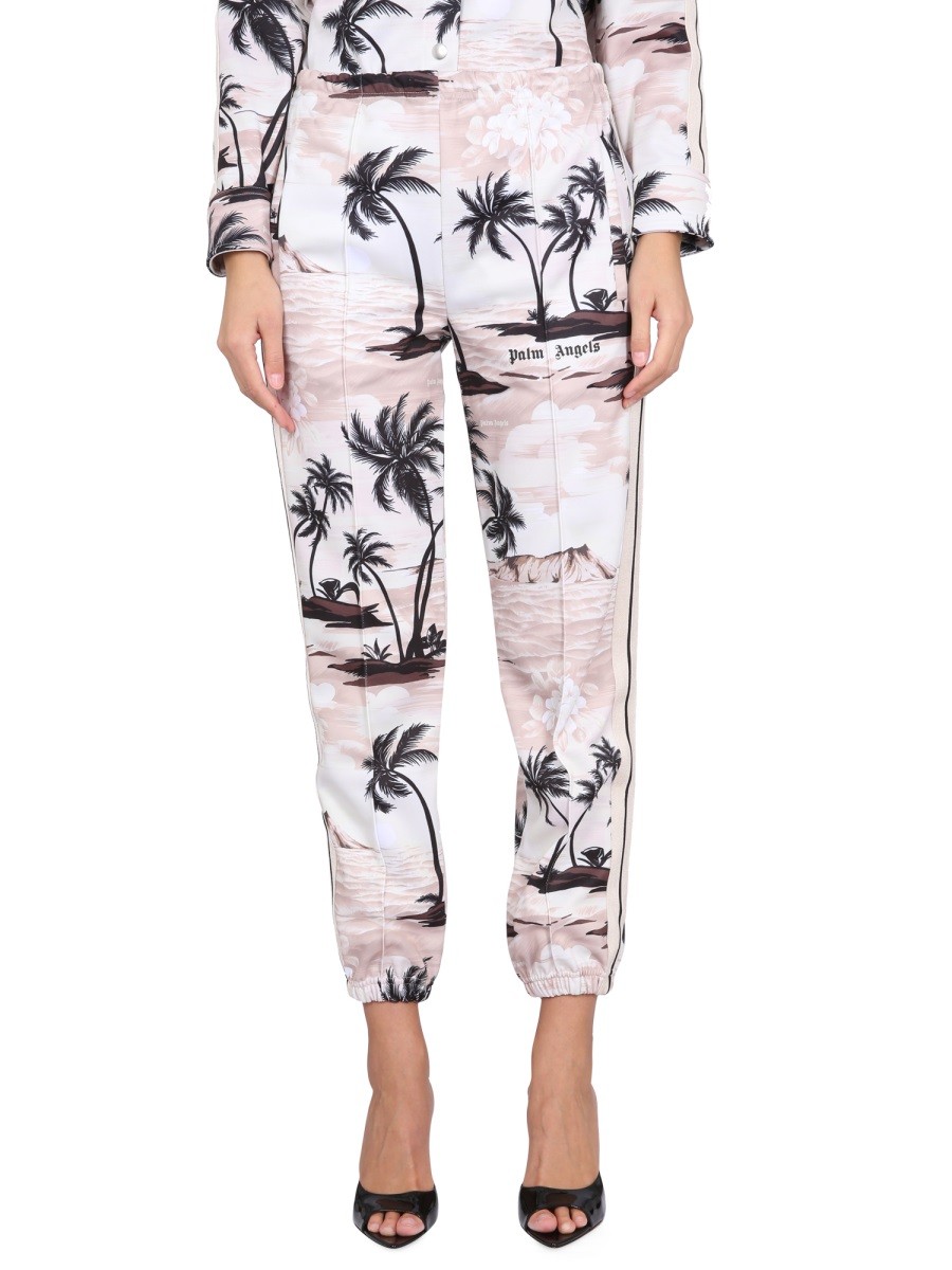 Discover the authentic Palm Angels women's ISLAND PRINT PANTS in beige