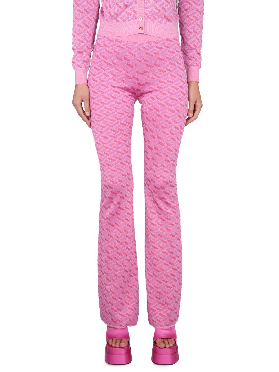 Discover the authentic Versace women's JACQUARD PANTS WITH GREEK PRINT in Pink