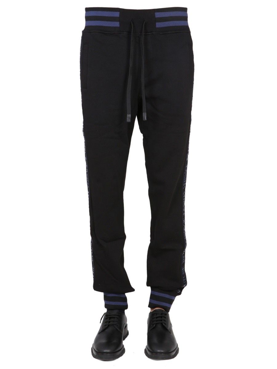 Refresh your wardrobe with the Versace Jeans Couture men's JOGGING PANTS WITH ELASTIC in Black