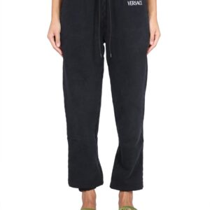 Refresh your wardrobe with the Versace women's JOGGING PANTS WITH LOGO in Black