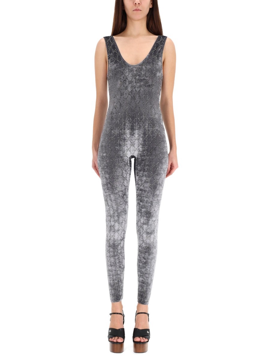 Discover the authentic Gucci women's JUMPSUIT WITH "GG" EMBROIDERY in Grey