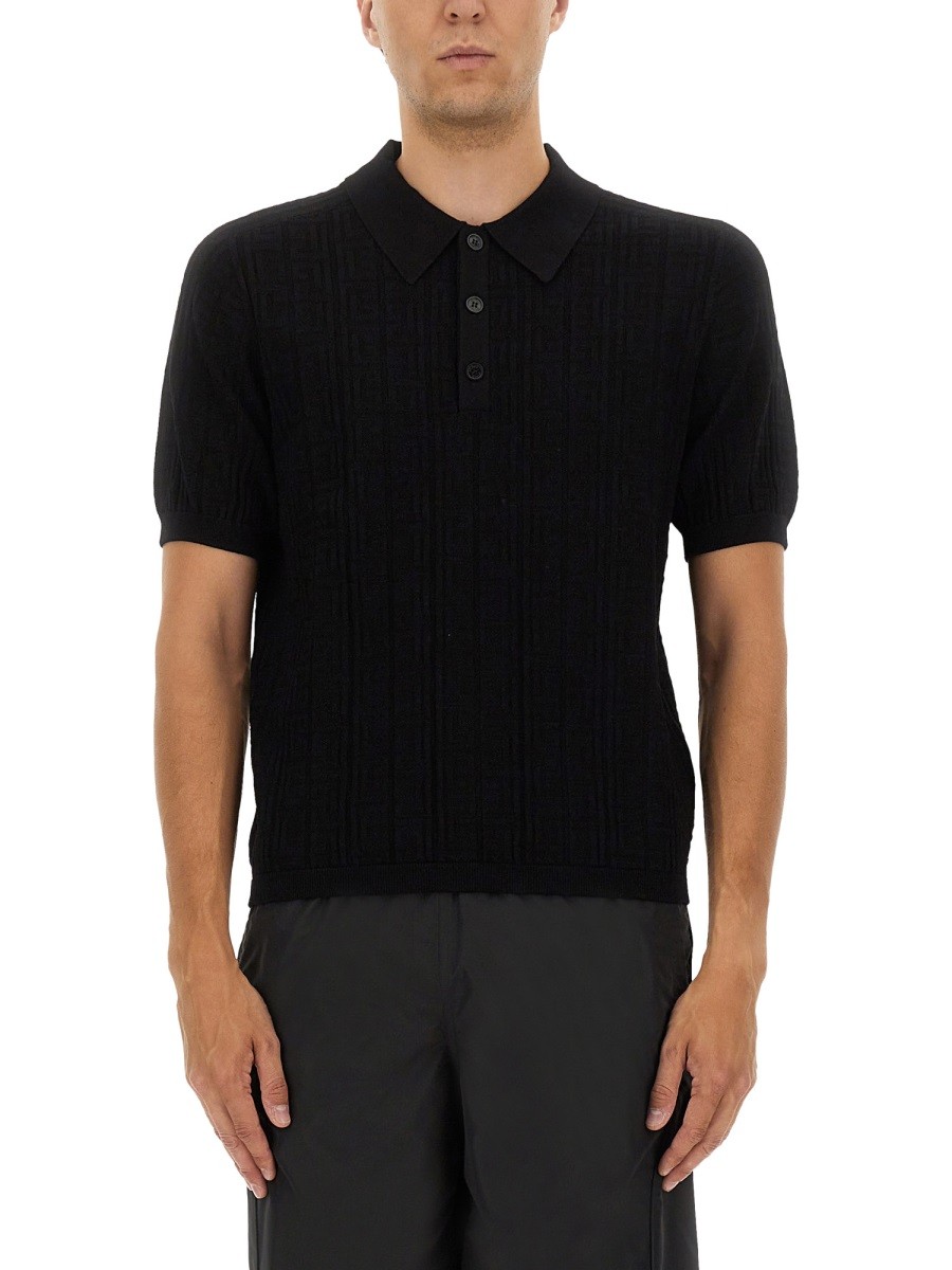 Refresh your wardrobe with the Balmain men's KNITTED POLO. in Black
