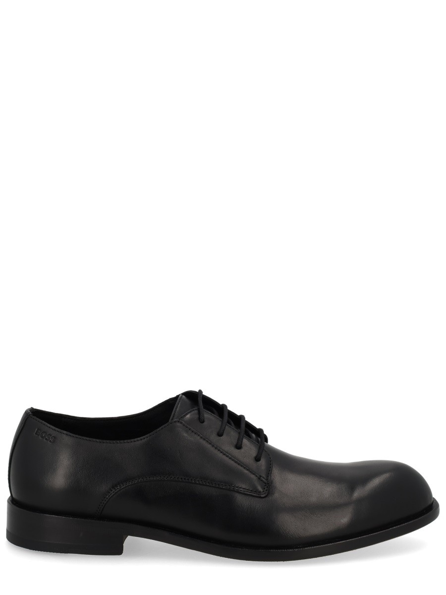 Refresh your wardrobe with the Boss men's LEATHER LOAFER in Black