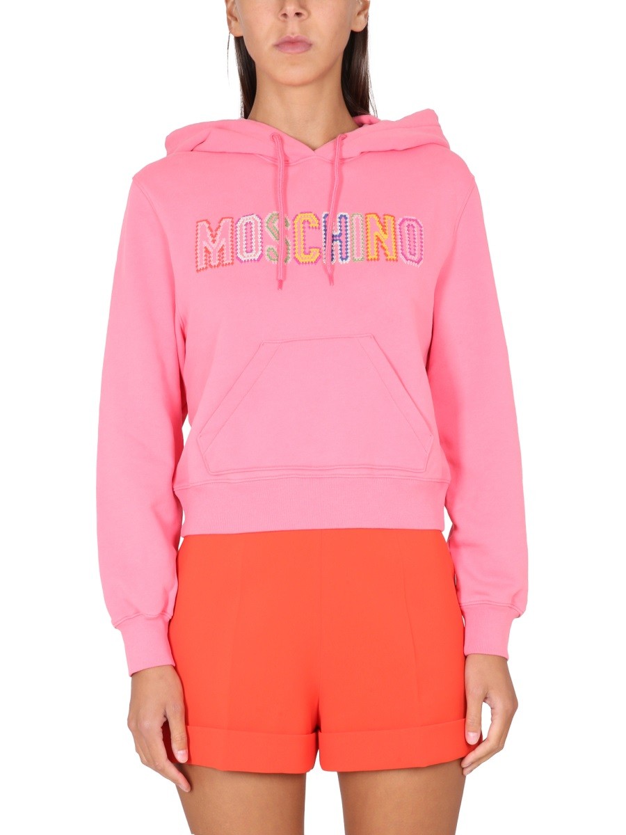 Refresh your wardrobe with the Moschino women's LOGO CROCHET SWEATSHIRT in Pink