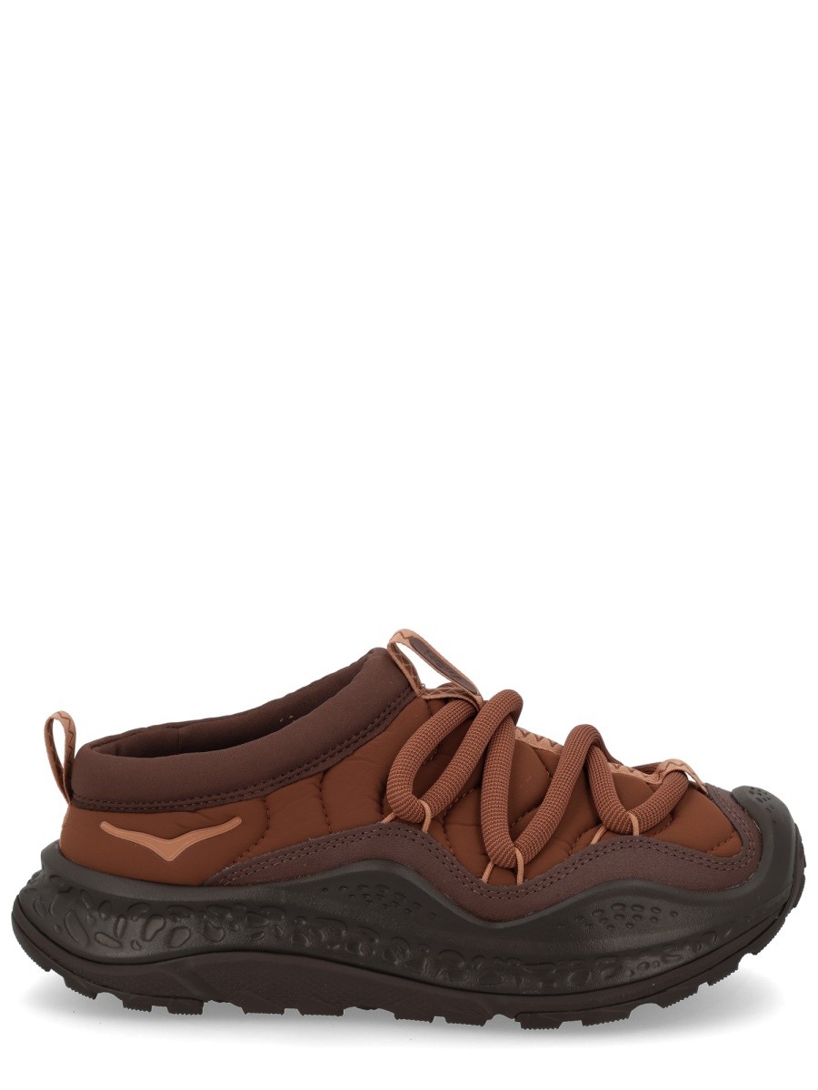 Refresh your wardrobe with the HOKA unisex "NOW FIRST" SNEAKER in Brown