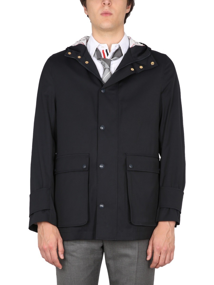 Refresh your wardrobe with the THOM BROWNE men's NYLON PARKA. in Blue