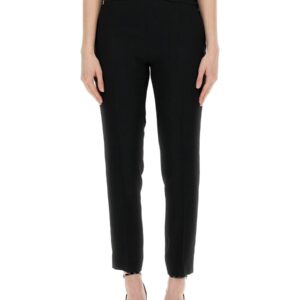 Explore the authentic Moschino women's PANTS WITH HEART APPLICATION in Black
