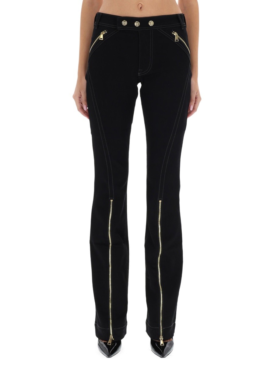 Explore the authentic Versace Jeans Couture women's PANTS WITH ZIPPER DETAIL in Black