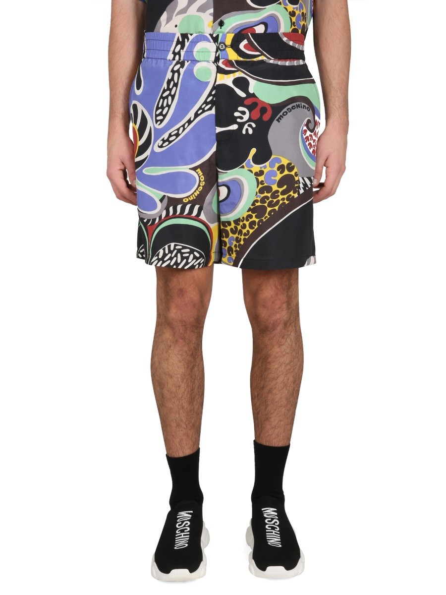 Explore the authentic Moschino men's PSYCHEDELIC PRINT BERMUDA SHORTS in MULTICOLOUR