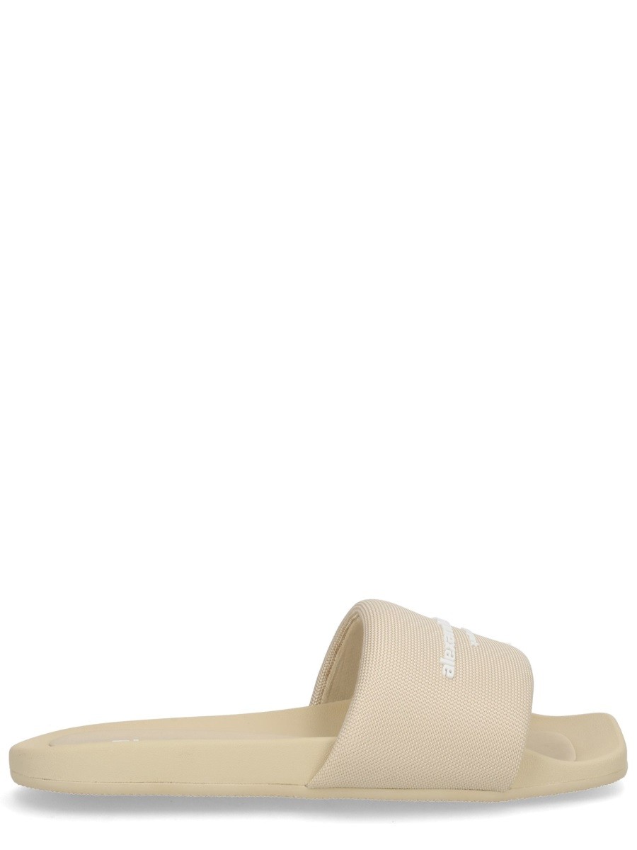 Refresh your wardrobe with the Alexander Wang women's SLIP-ON SLIPPER in POWDER