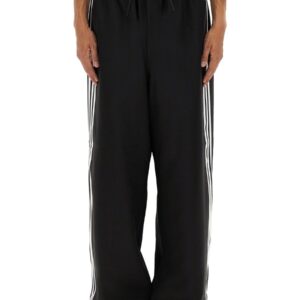 Explore the authentic Y - 3 men's "SPORT UNIFORM 3-STRIPES" PANTS in Black