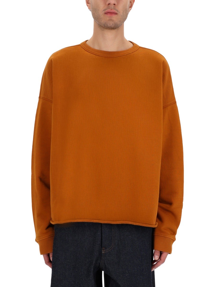 Refresh your wardrobe with the YMC men's "STUDIO" SWEATSHIRT in orange