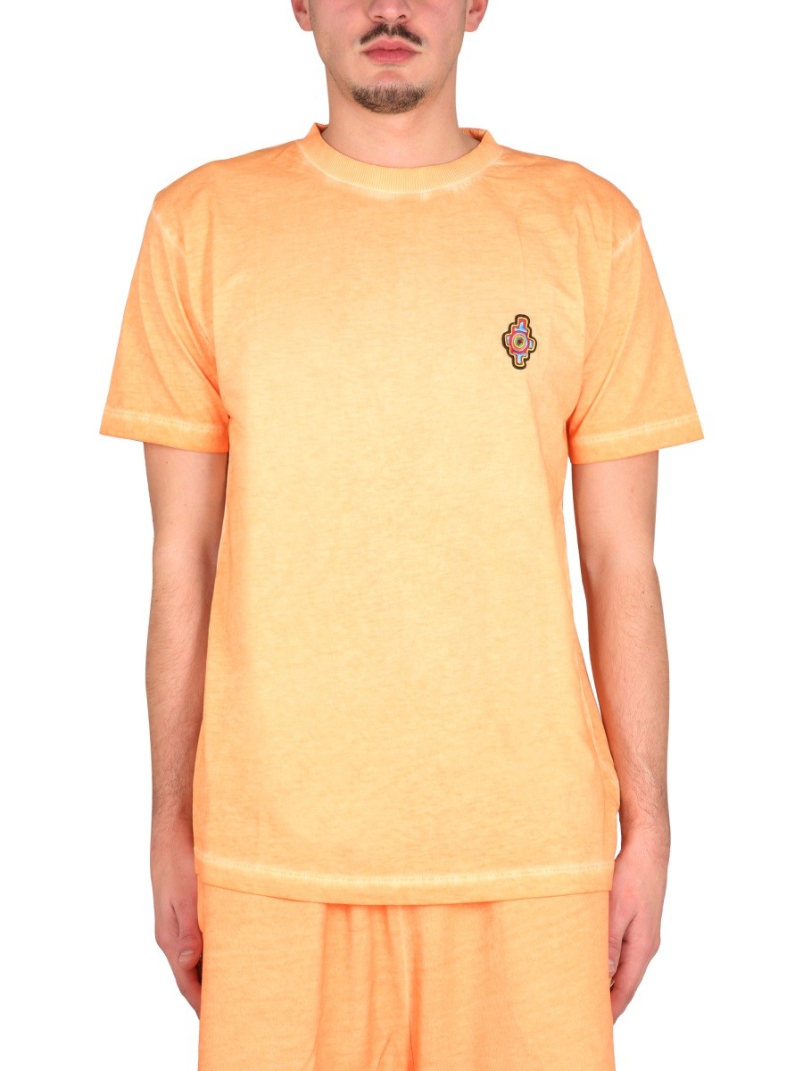 Shop the authentic MARCELO BURLON COUNTY OF MILAN men's SUNSET CROSS REGULAR T-SHIRT in orange