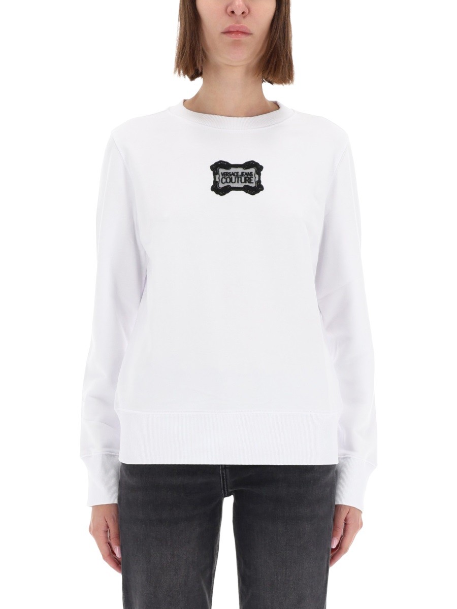 Shop the authentic Versace Jeans Couture women's SWEATSHIRT WITH "BAROQUE" LOGO PATCH in White