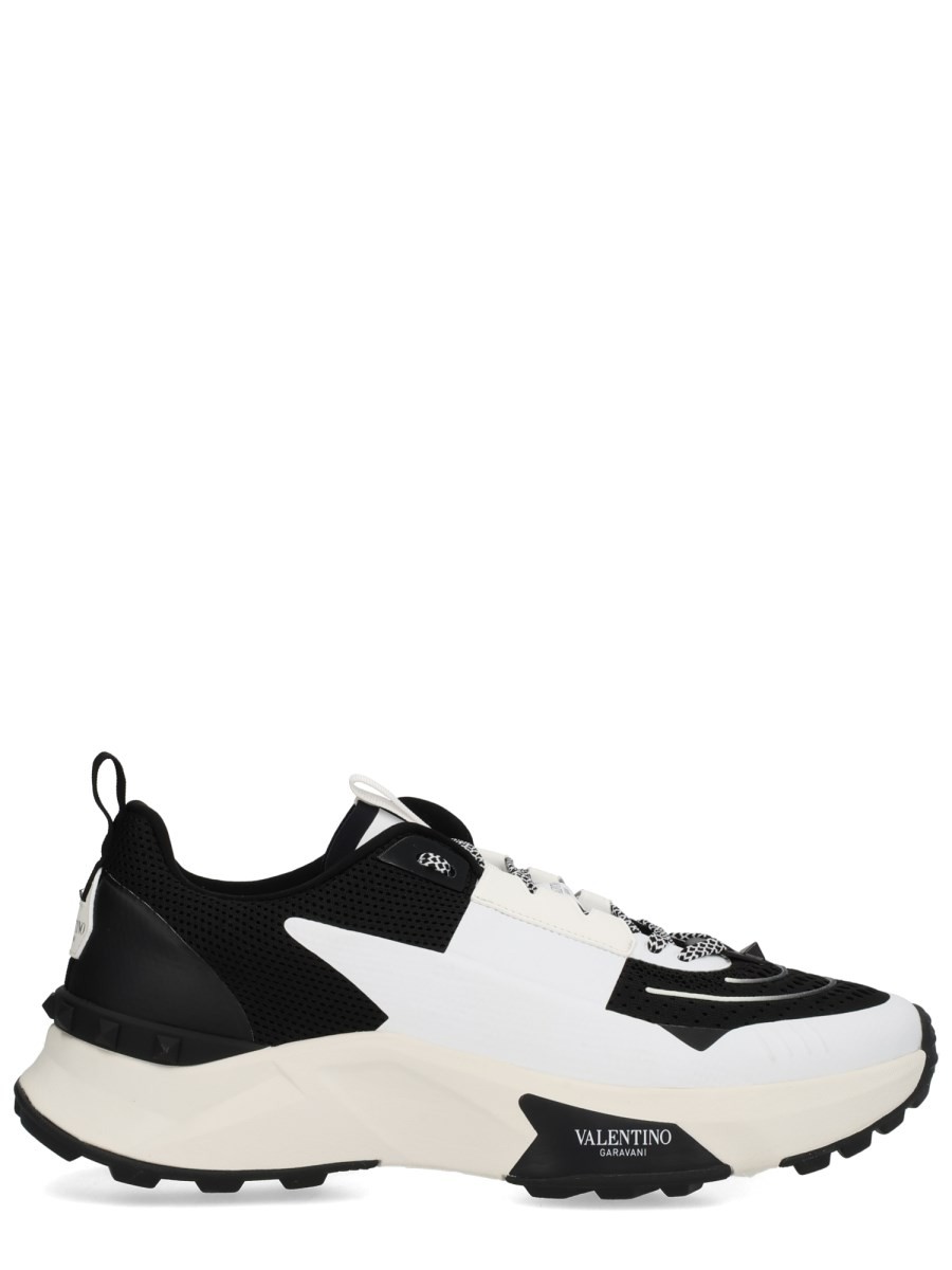 Explore the authentic Valentino Garavani men's "TRUE ACT" SNEAKER in Black