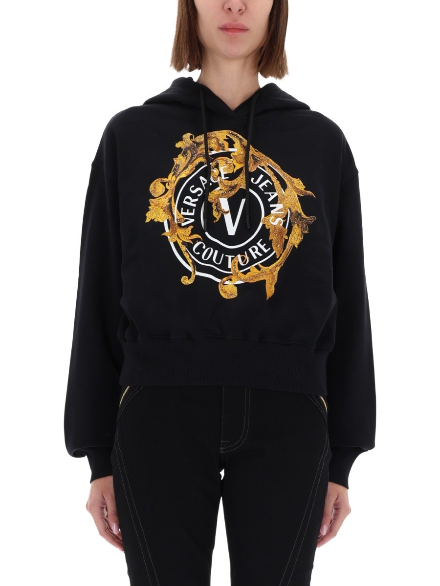 Explore the authentic Versace Jeans Couture women's "V-EMBLEM BAROQUE" SWEATSHIRT in Black