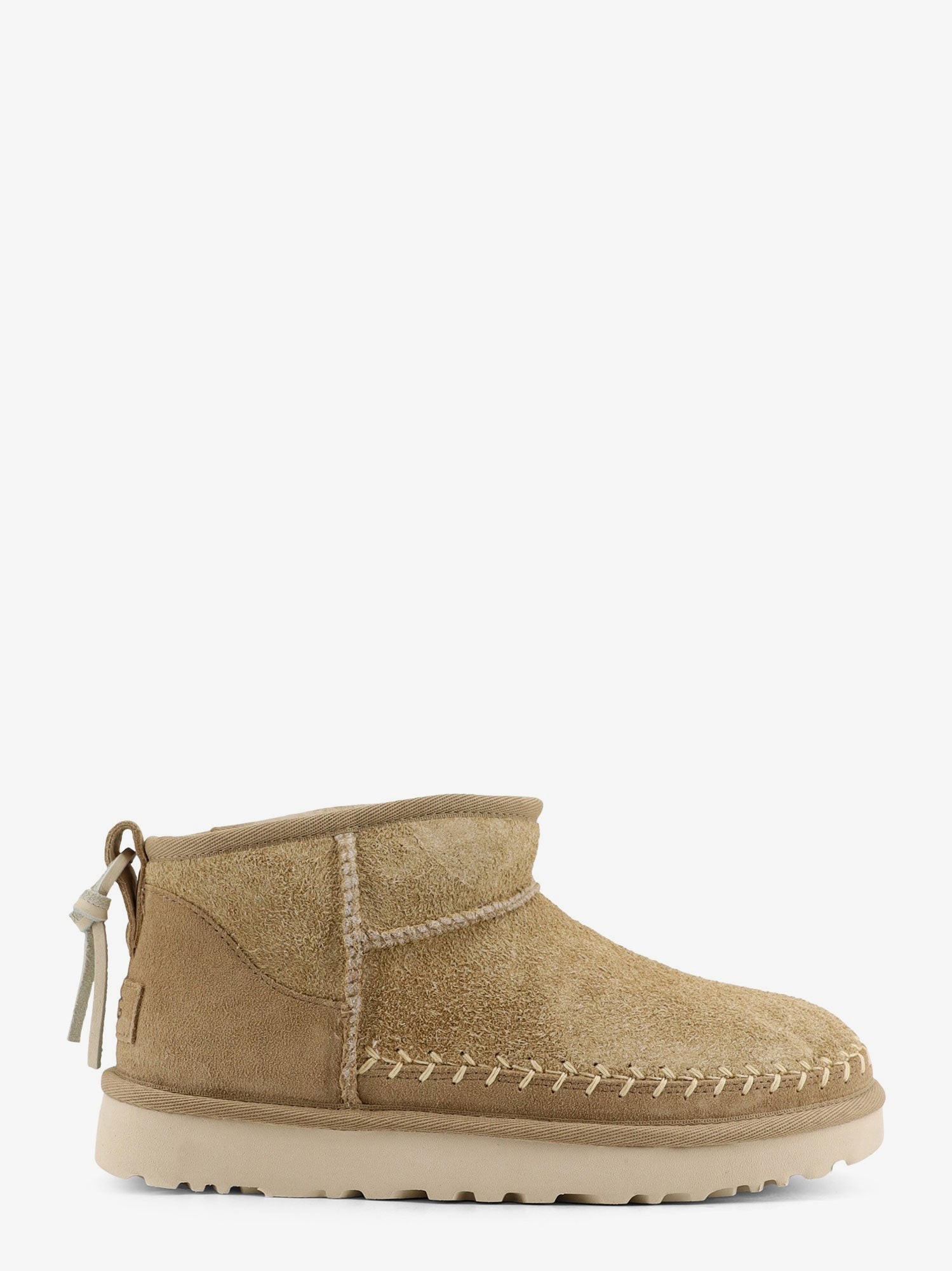 Shop the authentic Ugg women's W Classic Ultra Mini Biarritz suede ankle boots in MUSTARD SEED