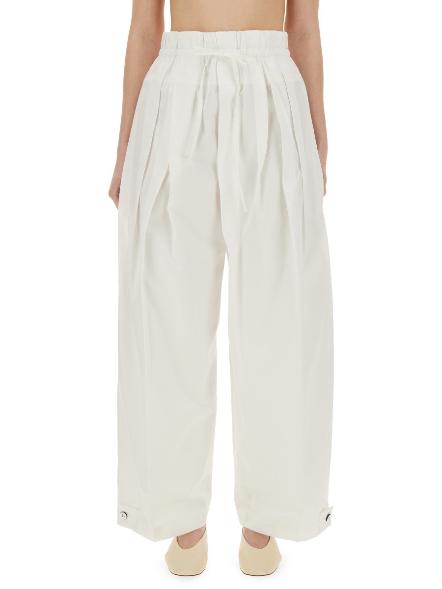 Explore the authentic JIL SANDER women's WIDE PANTS IN COTTON GABARDINE in White