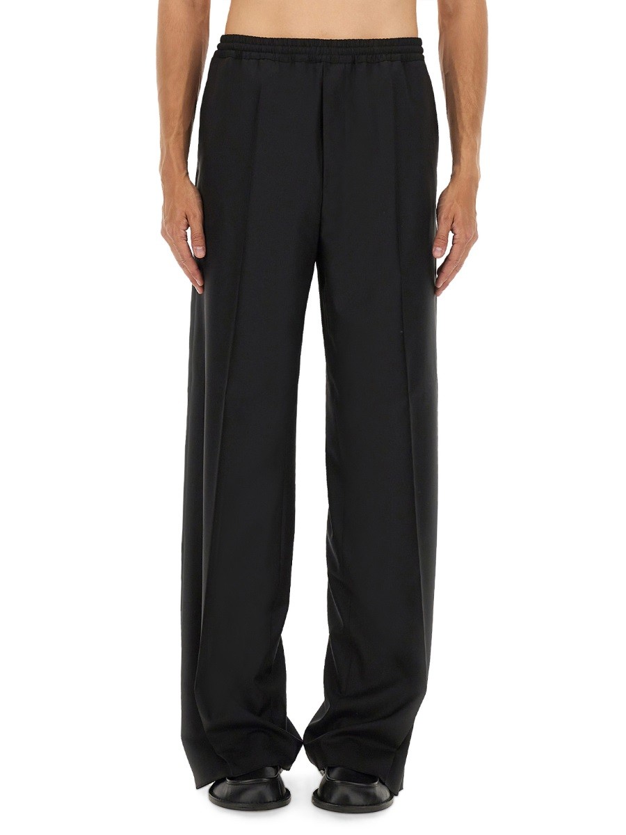 Refresh your wardrobe with the Moschino men's WOOL CANVAS PANTS in Black